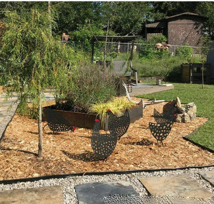 Doblaje de láminas de acero Soldadura de piezas de metal cortadas por láser OEM Arte jardín de césped Decoración de suelo placa de acero